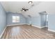 Open bonus room offering light blue walls, a ceiling fan, and great natural light at 11305 Hunters Landing Dr, Charlotte, NC 28273