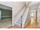 Elegant entryway with a staircase, hardwood flooring, and open access to other rooms at 11305 Hunters Landing Dr, Charlotte, NC 28273