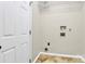 Handy laundry room ready for washer and dryer hookups with a wired rack overhead at 11305 Hunters Landing Dr, Charlotte, NC 28273