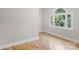 Cozy bedroom featuring hardwood floors, a large window with natural light at 1134 Willow Oaks Trl, Matthews, NC 28104