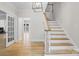 Bright foyer with hardwood floors, staircase, and open layout at 1134 Willow Oaks Trl, Matthews, NC 28104
