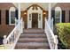 Close-up view of the front entrance, highlighting the brick stairs and classic design at 1134 Willow Oaks Trl, Matthews, NC 28104