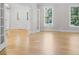 Open living room features hardwood floors, natural light, and modern finishes at 1134 Willow Oaks Trl, Matthews, NC 28104