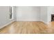 Bright, open living area with hardwood floors and a view of the fireplace at 1134 Willow Oaks Trl, Matthews, NC 28104