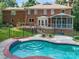 The backyard features a pool with tile accents, a surrounding deck, and a fenced yard at 1134 Willow Oaks Trl, Matthews, NC 28104