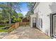 View of back of home featuring a wooden deck, white siding and manicured lawn at 11401 Lone Star Cir, Charlotte, NC 28226