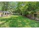 Well-maintained backyard with lush green grass and fenced perimeter for privacy at 11401 Lone Star Cir, Charlotte, NC 28226