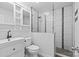 Modern bathroom featuring glass enclosed shower, stylish tile work, and vanity with storage at 11401 Lone Star Cir, Charlotte, NC 28226