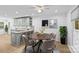 Stylish dining area with modern light fixture, granite counters, and stainless steel appliances at 11401 Lone Star Cir, Charlotte, NC 28226