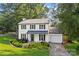 Charming two-story home with a manicured lawn, white siding and a driveway leading to the garage at 11401 Lone Star Cir, Charlotte, NC 28226