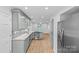 Bright kitchen with stainless steel appliances, granite countertops, and access to backyard at 11401 Lone Star Cir, Charlotte, NC 28226