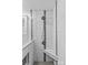 A stunning, tiled walk-in shower features a built in bench and black accent tiles at 11401 Lone Star Cir, Charlotte, NC 28226