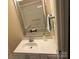 Bathroom featuring a vanity with chrome faucet, mirror, and a shower-tub combo at 13221 Brandywine Ln, Midland, NC 28107