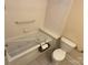 Bathroom featuring a jacuzzi tub, toilet, and tiled walls and flooring at 13221 Brandywine Ln, Midland, NC 28107