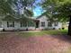 Charming single-story home with muted siding, dark shutters, and a neatly maintained front yard at 13221 Brandywine Ln, Midland, NC 28107