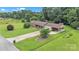 Aerial view of house showcasing its curb appeal, large yard, and long driveway at 137 Proust Rd, Statesville, NC 28625