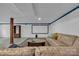 Open basement with sofa and projector screen at 137 Proust Rd, Statesville, NC 28625