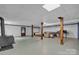 Spacious basement with wooden support columns and drop ceiling at 137 Proust Rd, Statesville, NC 28625