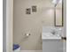 Simple bathroom with a sink, toilet, decorative pictures, and neutral-colored walls at 137 Proust Rd, Statesville, NC 28625