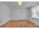 Spacious bedroom featuring hardwood floors, a ceiling fan, and a window with sheer white curtains at 137 Proust Rd, Statesville, NC 28625