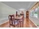 Formal dining room with hardwood floors, chandelier lighting, and vintage furniture at 137 Proust Rd, Statesville, NC 28625