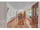 Formal dining room with hardwood floors, large windows, and chandelier lighting at 137 Proust Rd, Statesville, NC 28625
