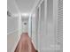 Hallway featuring hardwood floors, neutral paint, and built in storage at 137 Proust Rd, Statesville, NC 28625