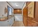 Convenient laundry room with tile flooring, washer, dryer, and ample storage space at 137 Proust Rd, Statesville, NC 28625