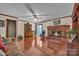 Cozy living room with hardwood floors and brick fireplace, perfect for relaxing or entertaining at 137 Proust Rd, Statesville, NC 28625
