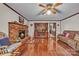 Inviting living room with brick fireplace, hardwood floors, and comfortable seating area at 137 Proust Rd, Statesville, NC 28625