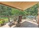 Outdoor patio with dining set and view of the pool at 137 Proust Rd, Statesville, NC 28625
