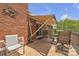 Covered patio with brick wall and ample seating at 137 Proust Rd, Statesville, NC 28625