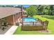 Backyard featuring an above ground pool with deck, patio, and mature landscaping at 137 Proust Rd, Statesville, NC 28625
