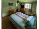 Comfortable bedroom featuring hardwood floors, light walls, and ample natural light at 1512 Thompson Ave, Charlotte, NC 28216