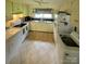 Efficient kitchen with appliances, ample counter space, and bright natural light at 1512 Thompson Ave, Charlotte, NC 28216