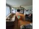 Comfortable living room with hardwood floors, neutral walls, and inviting seating area at 1512 Thompson Ave, Charlotte, NC 28216