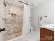 Modern bathroom featuring a stylish tiled walk-in shower with elegant fixtures and clean tile floors at 1711 Apple Tree Ln # 28, Fort Mill, SC 29715
