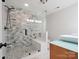 Modern bathroom with a frameless glass shower, decorative tile surround, and a floating vanity at 1711 Apple Tree Ln # 28, Fort Mill, SC 29715