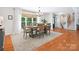 Dining room features a wood table, chandelier, and a large window with natural light and backyard view at 1711 Apple Tree Ln # 28, Fort Mill, SC 29715
