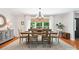 Elegant dining room features a wooden table, chandelier, and a large window with natural light at 1711 Apple Tree Ln # 28, Fort Mill, SC 29715