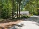 Charming home exterior with stone details, a welcoming driveway, and lush green surroundings at 1711 Apple Tree Ln # 28, Fort Mill, SC 29715