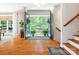 Beautiful foyer featuring hardwood floors, staircase, and double front doors open to mature trees at 1711 Apple Tree Ln # 28, Fort Mill, SC 29715
