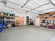 Spacious two car garage with ample shelving and storage at 1711 Apple Tree Ln # 28, Fort Mill, SC 29715