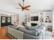 Inviting living room featuring a sectional sofa, fireplace, built-in shelving, and double front doors at 1711 Apple Tree Ln # 28, Fort Mill, SC 29715