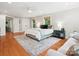 Spacious main bedroom with hardwood floors, natural light, and an ensuite bathroom at 1711 Apple Tree Ln # 28, Fort Mill, SC 29715