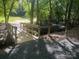 A wooden bridge crosses the landscape with a stone walking trail leading to a grassy knoll at 18038 Greyfield Gln, Fort Mill, SC 29707