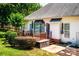 Backyard featuring a wood deck, mature landscaping, well maintained lawn and a small garden area at 2124 Congress Ct, Kannapolis, NC 28083