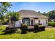 Well-maintained backyard featuring a wooden deck, lush lawn, mature trees, and a black metal fence at 2124 Congress Ct, Kannapolis, NC 28083