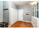Inviting entryway featuring hardwood floors, closet, and built-in storage, creating a welcoming and organized space at 2124 Congress Ct, Kannapolis, NC 28083