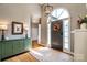 Inviting entryway showcasing hardwood floors, a decorative front door, and a stylish light fixture at 2124 Congress Ct, Kannapolis, NC 28083